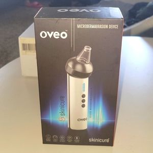 Oveo microdermabrasion skin device,  colors are white/black
